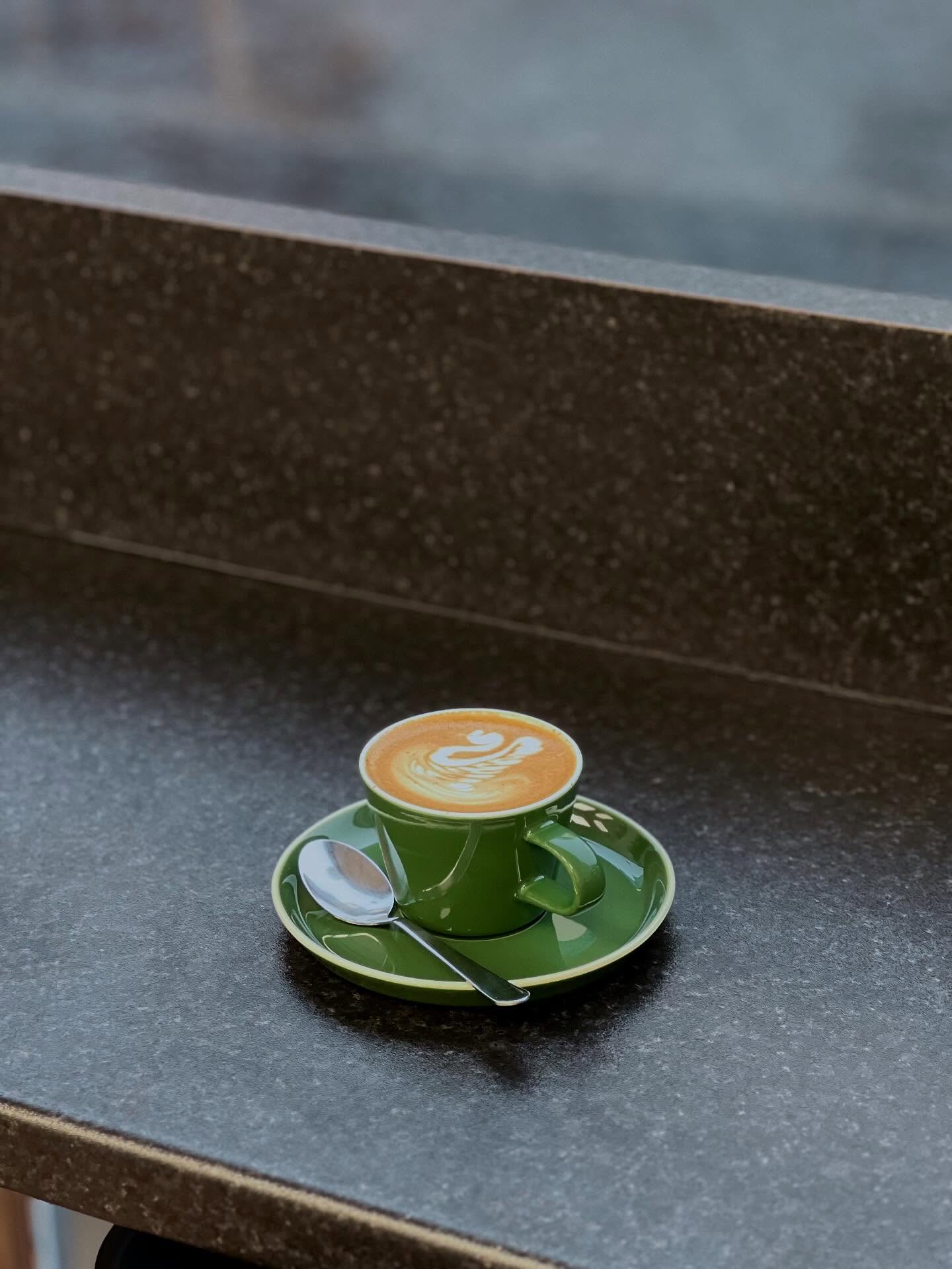 Flat white in a green cup